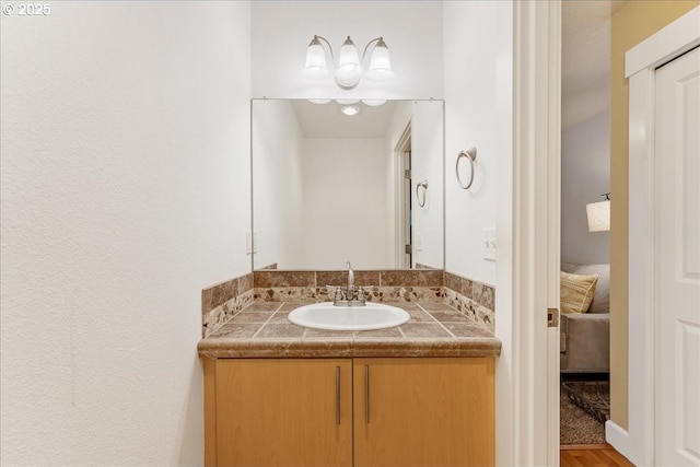 bathroom with ensuite bath and vanity