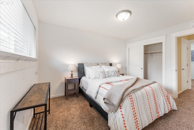 bedroom with light colored carpet, a closet, and baseboards