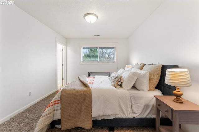 bedroom featuring visible vents, baseboards, and carpet floors