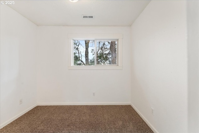 unfurnished room featuring visible vents, baseboards, and carpet flooring