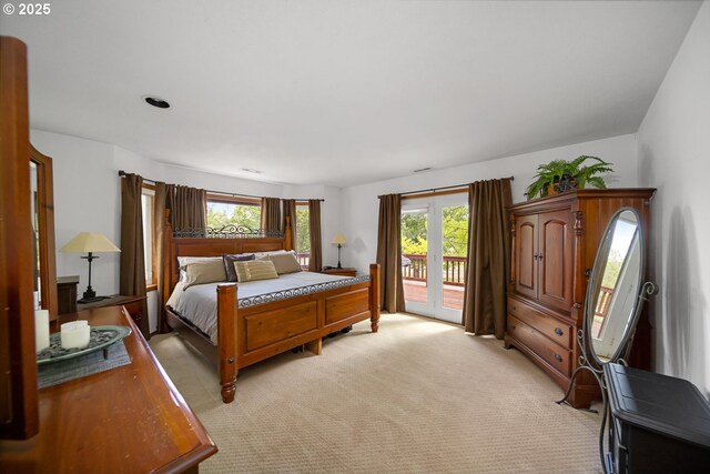 33817 Gage Rd, Mitchell, OR 97750 - bedroom with access to outside, multiple windows, and light colored carpet