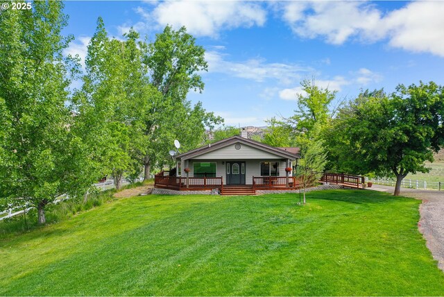 33817 Gage Rd, Mitchell, OR 97750 - rear view of property with a yard and a wooden deck