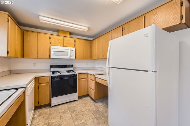 1006 NE 45th St Unit C8, Vancouver, WA 98663 - kitchen featuring white appliances, stone finish floor, and light countertops