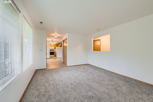 1006 NE 45th St Unit C8, Vancouver, WA 98663 - unfurnished room with baseboards and light colored carpet