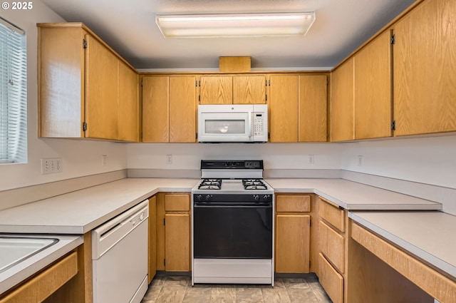 1006 NE 45th St Unit C8, Vancouver, WA 98663 - kitchen featuring light countertops and white appliances