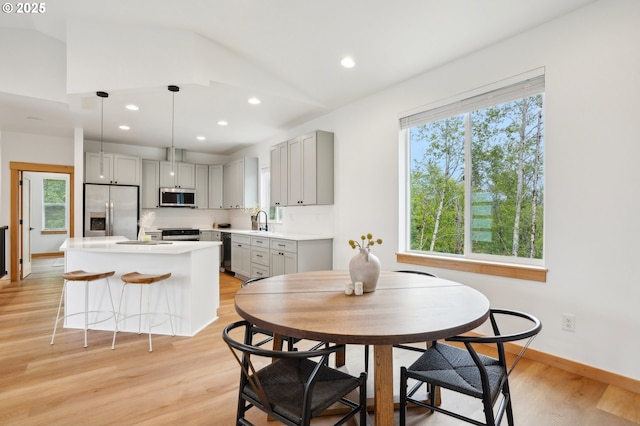 16000 NE Grantham Rd, Amboy, WA 98601 - dining room featuring plenty of natural light, light wood finished floors, vaulted ceiling, recessed lighting, and baseboards
