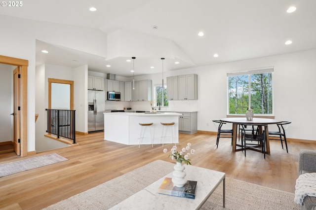 16000 NE Grantham Rd, Amboy, WA 98601 - living room with lofted ceiling, recessed lighting, light wood-style floors, and baseboards