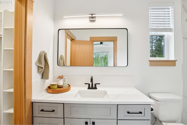16000 NE Grantham Rd, Amboy, WA 98601 - bathroom featuring vanity, toilet, and ceiling fan