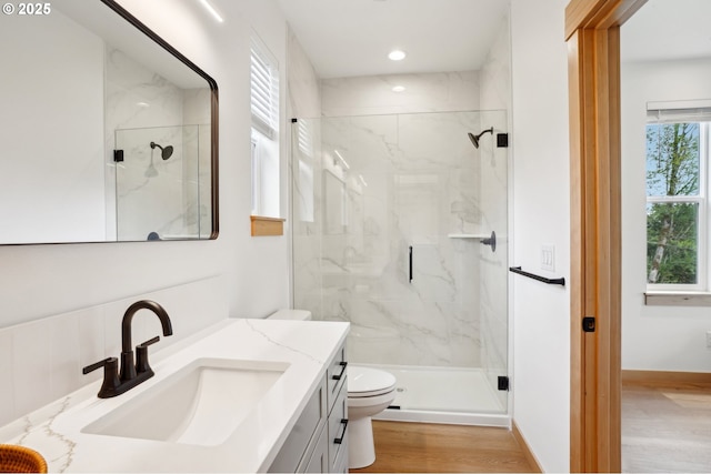 16000 NE Grantham Rd, Amboy, WA 98601 - full bathroom featuring toilet, a marble finish shower, vanity, wood finished floors, and recessed lighting