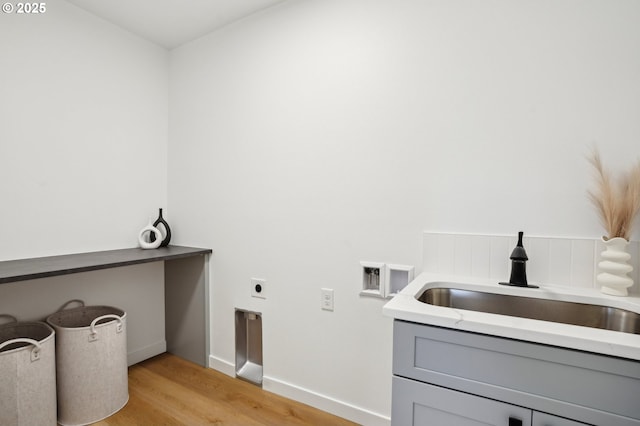 16000 NE Grantham Rd, Amboy, WA 98601 - washroom featuring light wood-type flooring, cabinet space, baseboards, hookup for an electric dryer, and hookup for a washing machine