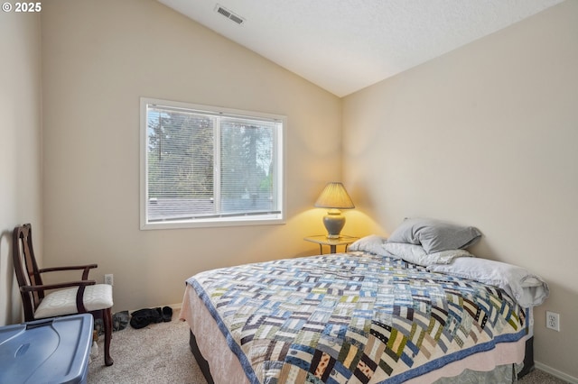 carpeted bedroom featuring vaulted ceiling