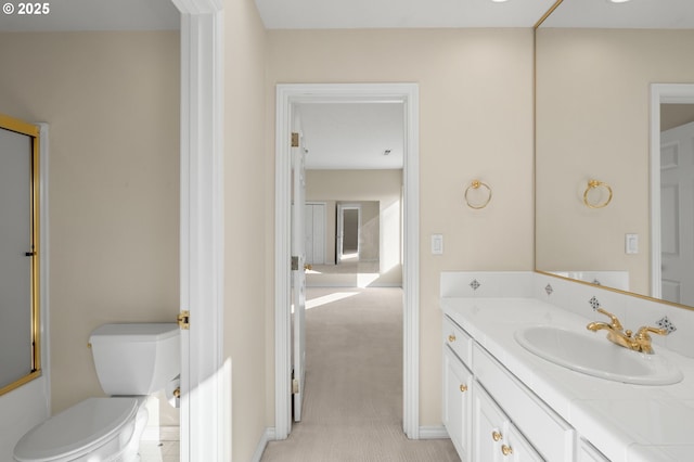 14405 NW Valley View Ln, Portland, OR 97231 - bathroom featuring vanity, toilet, a shower with shower door, and baseboards