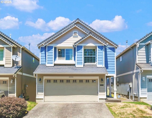 20551 SW Tesoro Ct, Beaverton, OR 97003 - view of front of house featuring an attached garage and concrete driveway