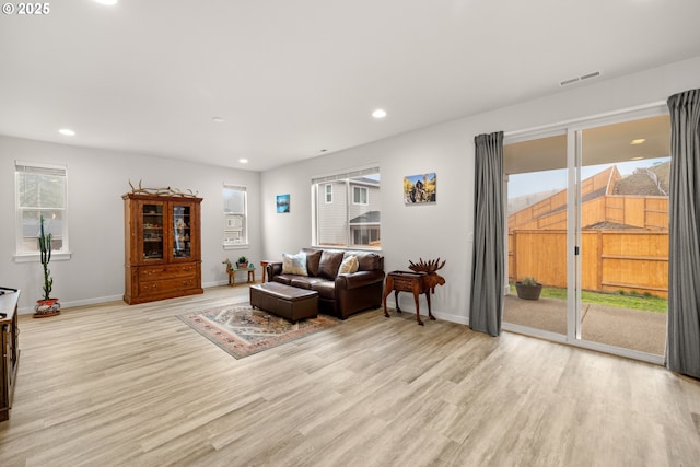 living room with light hardwood / wood-style floors