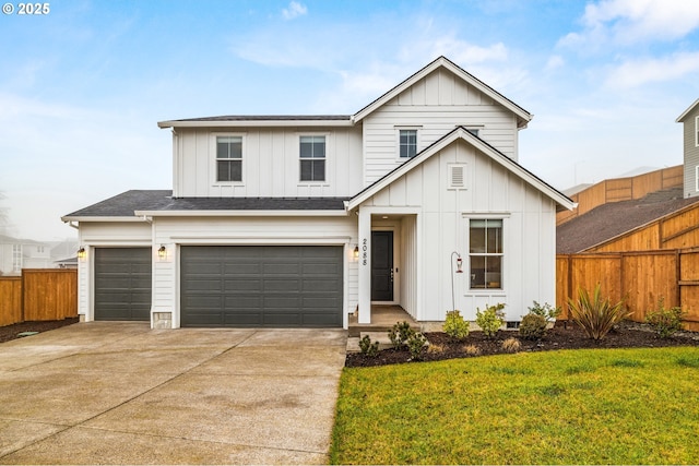 view of front of property featuring a front lawn and a garage