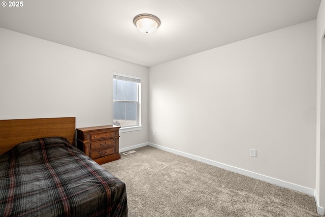 bedroom with light colored carpet