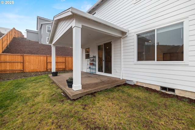 back of property featuring a yard and a patio