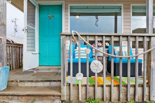 view of exterior entry featuring fence