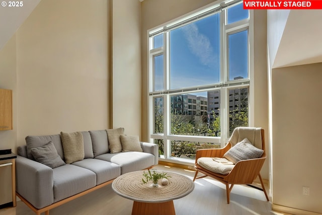 12600 SW Crescent St Unit 219, Beaverton, OR 97005 - interior space featuring wood finished floors and a towering ceiling
