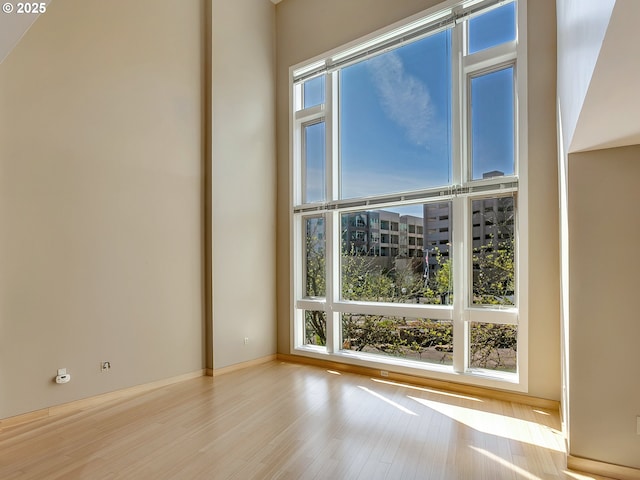 12600 SW Crescent St Unit 219, Beaverton, OR 97005 - empty room featuring wood finished floors and a wealth of natural light