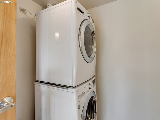 12600 SW Crescent St Unit 219, Beaverton, OR 97005 - clothes washing area with stacked washer / drying machine and laundry area