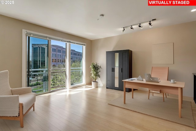 12600 SW Crescent St Unit 219, Beaverton, OR 97005 - home office featuring light wood-type flooring and rail lighting