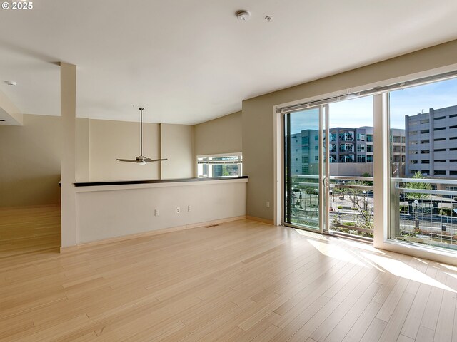 12600 SW Crescent St Unit 219, Beaverton, OR 97005 - unfurnished room featuring wood finished floors, ceiling fan, and a view of city