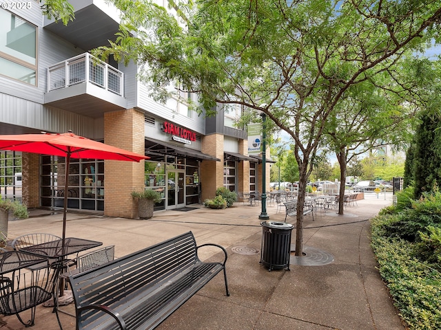 12600 SW Crescent St Unit 219, Beaverton, OR 97005 - surrounding community with a patio area