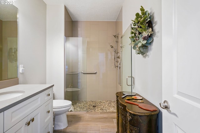 1715 York Butte Ave, Salem, OR 97306 - full bath featuring vanity, toilet, wood finished floors, and a shower stall