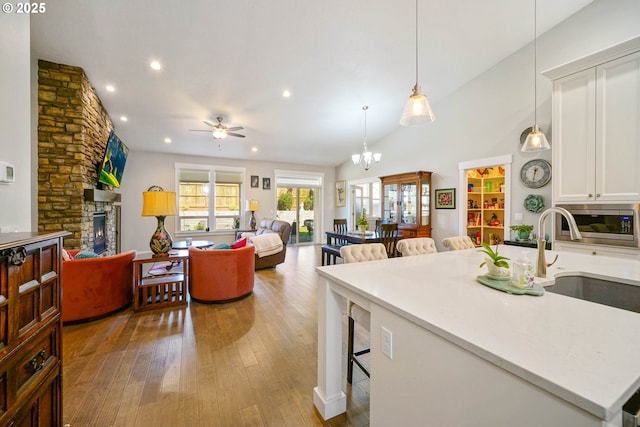 1715 York Butte Ave, Salem, OR 97306 - kitchen with recessed lighting, a sink, stainless steel microwave, ceiling fan with notable chandelier, and white cabinets