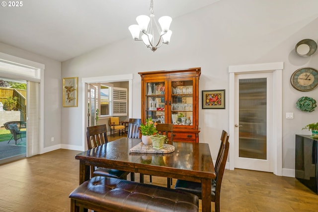 1715 York Butte Ave, Salem, OR 97306 - dining area with baseboards, an inviting chandelier, wood finished floors, and vaulted ceiling