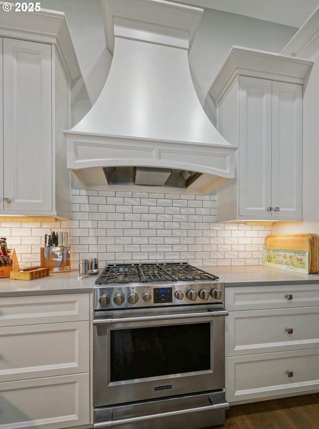 1715 York Butte Ave, Salem, OR 97306 - kitchen with white cabinetry, light countertops, premium range hood, and high end stove
