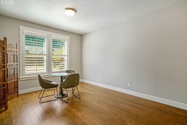 1715 York Butte Ave, Salem, OR 97306 - dining area featuring a textured ceiling, baseboards, and wood finished floors