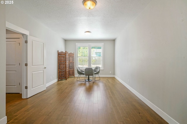 1715 York Butte Ave, Salem, OR 97306 - living area featuring baseboards, a textured ceiling, and wood finished floors