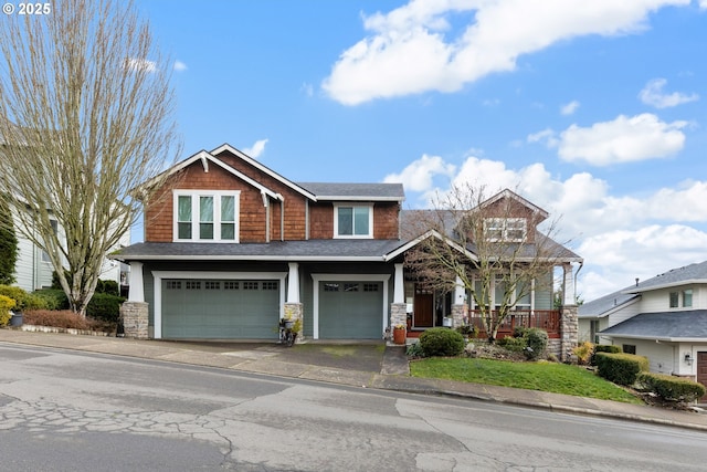 craftsman-style home with covered porch and a garage