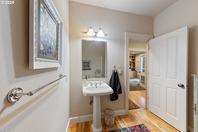 bathroom with hardwood / wood-style floors