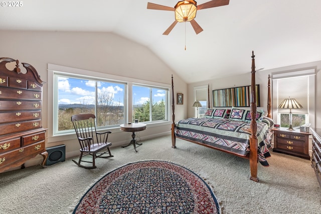 carpeted bedroom with ceiling fan and lofted ceiling