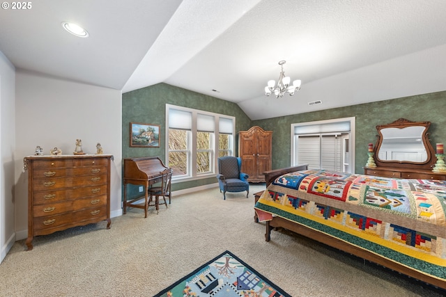 bedroom featuring carpet, vaulted ceiling, and an inviting chandelier