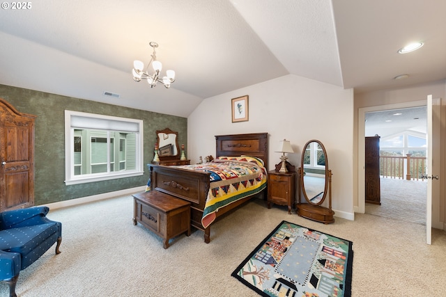 bedroom featuring a chandelier, light colored carpet, and lofted ceiling