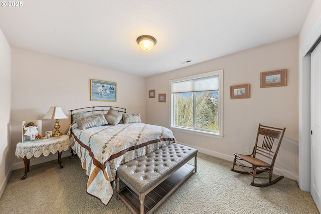 bedroom featuring carpet floors and a closet