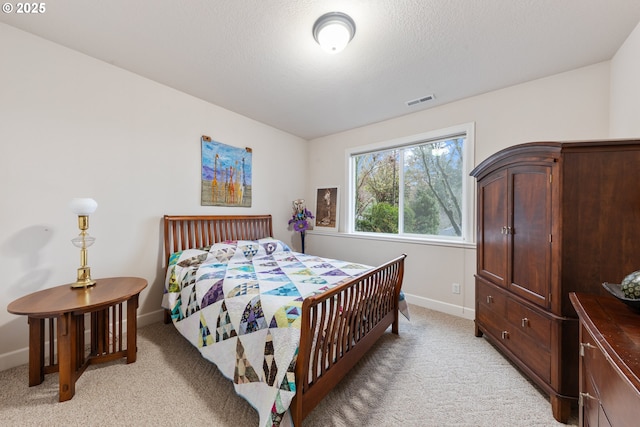 bedroom with light carpet