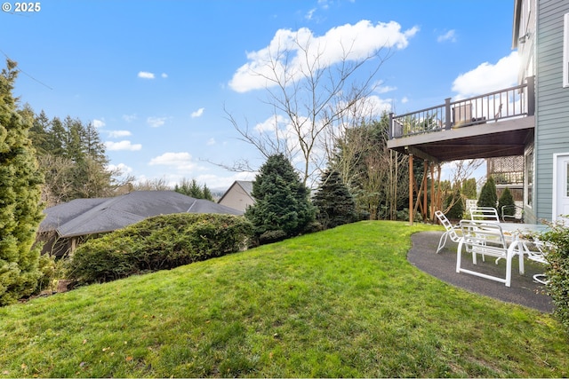 view of yard featuring a wooden deck