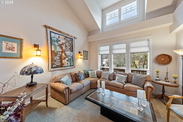 living room featuring a towering ceiling