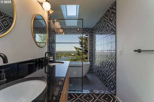 bathroom featuring a skylight and vanity