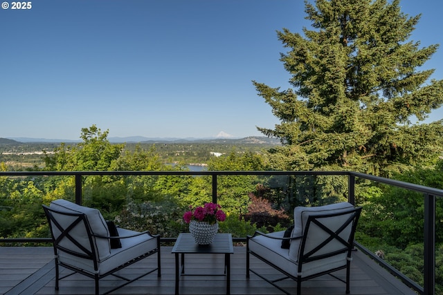 balcony featuring a mountain view