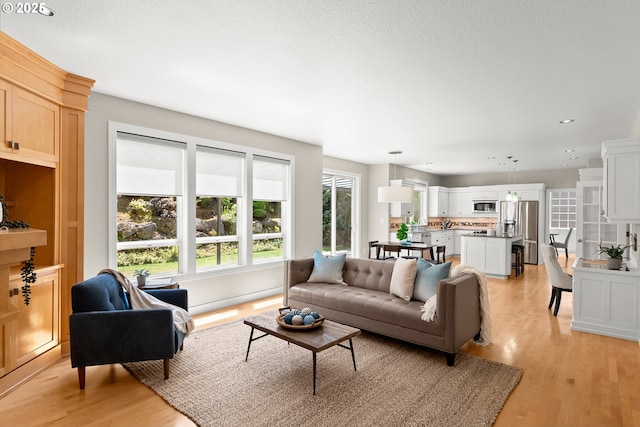 12758 NW Waker Dr, Portland, OR 97229 - living area with light wood-style flooring and recessed lighting