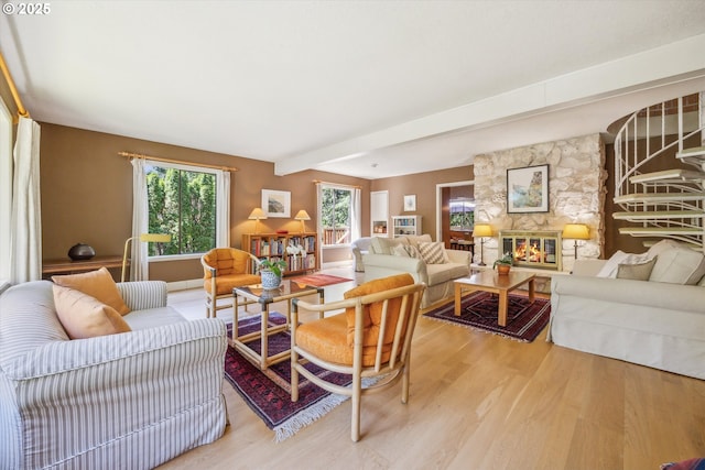 15 Cellini Ct, Lake Oswego, OR 97035 - living room with light wood-style floors, a stone fireplace, and beam ceiling