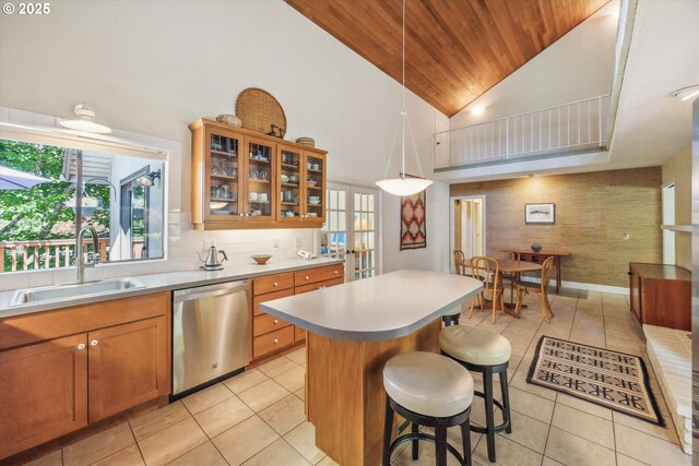 15 Cellini Ct, Lake Oswego, OR 97035 - kitchen featuring dishwasher, a sink, wooden ceiling, light tile patterned floors, and high vaulted ceiling