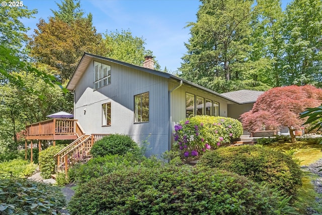 15 Cellini Ct, Lake Oswego, OR 97035 - view of home's exterior with a chimney, a wooden deck, and stairway