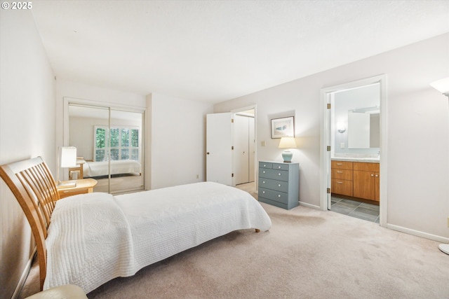15 Cellini Ct, Lake Oswego, OR 97035 - bedroom with a closet, light carpet, connected bathroom, and baseboards